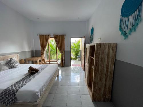 Postel nebo postele na pokoji v ubytování Dega Gardens