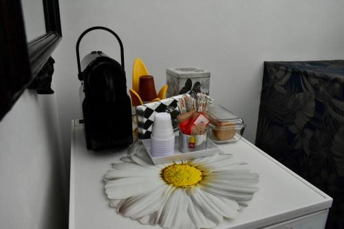 a white table with a flower on top of it at B&B Rosa e Rino in Turin