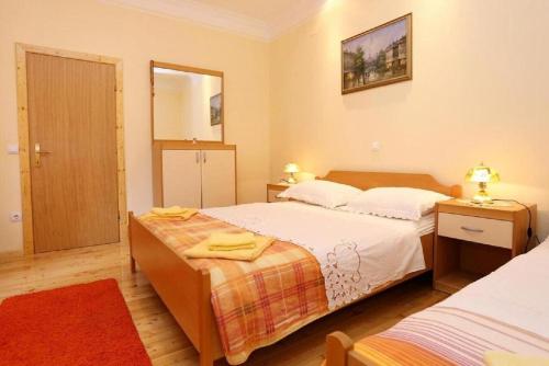 Posteľ alebo postele v izbe v ubytovaní Apartments Stuk