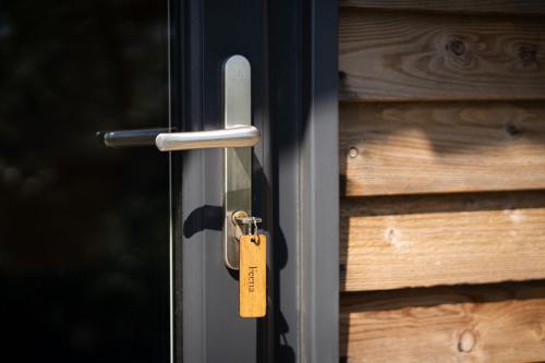 a metal door with a tag on it at Grassington Farm by Wigwam Holidays in Helston