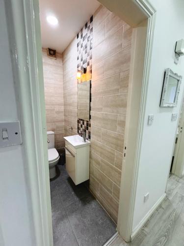 a bathroom with a toilet and a sink at Sea view 3 bedrooms apartment in Limassol