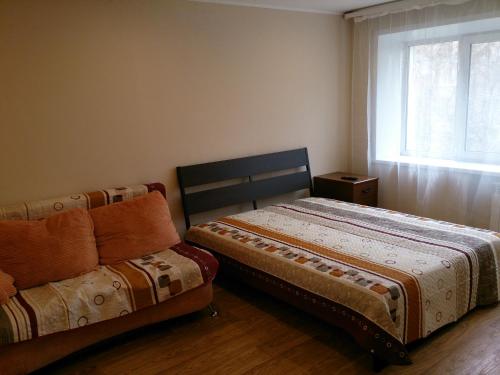 Кровать или кровати в номере Апартаменты на Площади Маркса