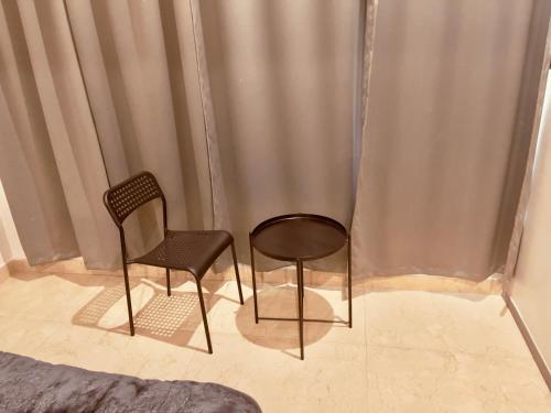 two chairs sitting next to each other in a room at Private 3 BHK - Woodstock Villa Amritsar in Amritsar