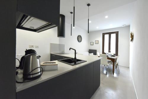 a kitchen with a sink and a counter top at Belvedere Campanon in Nizza Monferrato