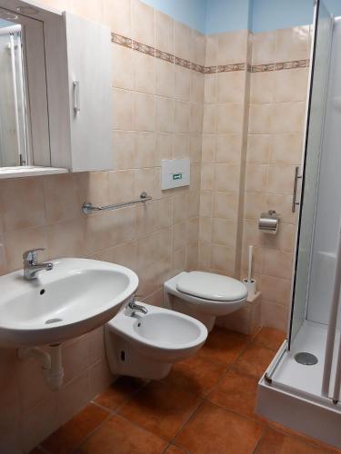 a bathroom with a sink and a toilet and a shower at Agriturismo La Bella Manza in Lurate Caccivio