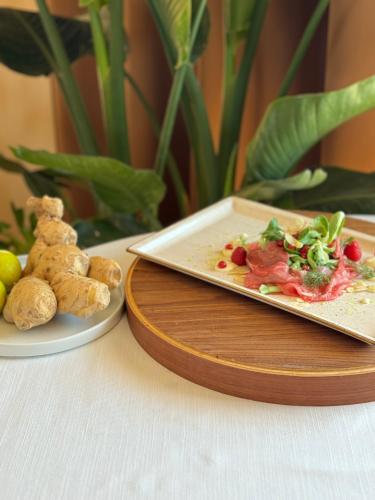 a plate of food on a table with a plate of food at Grand Hotel Forlì in Forlì