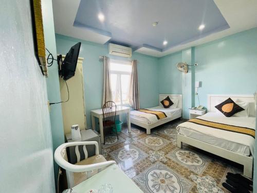 Katil atau katil-katil dalam bilik di Khách Sạn Ngọc Ly 3