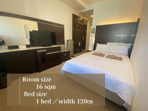 Cama ou camas em um quarto em Cross Wave Umeda