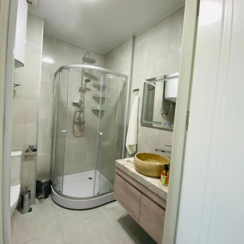 a bathroom with a shower and a sink at green house in Batumi