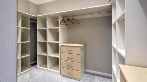 a walk in closet with white walls and shelves at Newby Bridge Country Caravan Park in Newby Bridge