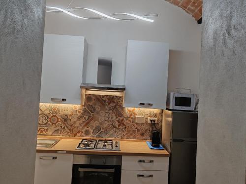 Kuchyň nebo kuchyňský kout v ubytování Casa del Prof - Casa vacanze in centro storico