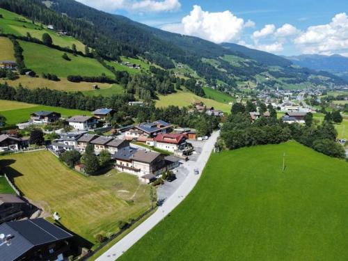 an aerial view of a small town in a green valley at Haus Eckhausl Family in Bramberg am Wildkogel