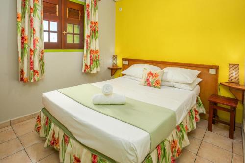 Postel nebo postele na pokoji v ubytování Villa Vanille - Maison avec piscine partagée