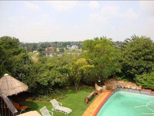 an image of a swimming pool in a yard at Gateway Guesthouse in Benoni