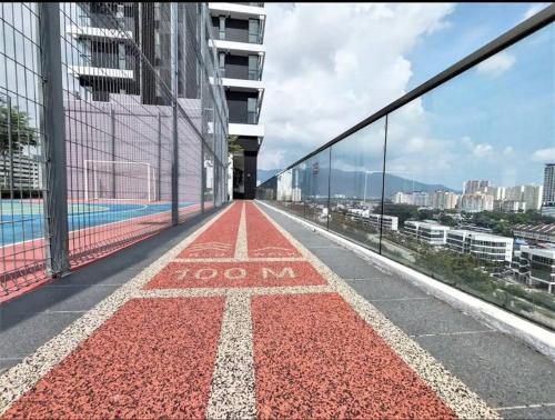 a red floor on the side of a building at High Floor, 3BR 3queen bed, 2 parking, Urban Suites by XWHome in Jelutong