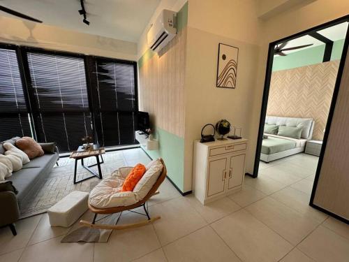 a living room with a couch and a table at High Floor, 3BR 3queen bed, 2 parking, Urban Suites by XWHome in Jelutong