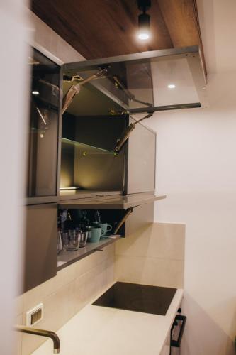 a kitchen with a counter with a sink in it at DUGA PARK lux in Kragujevac