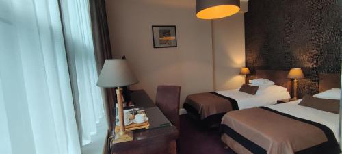 Postel nebo postele na pokoji v ubytování Hotel Szara Willa
