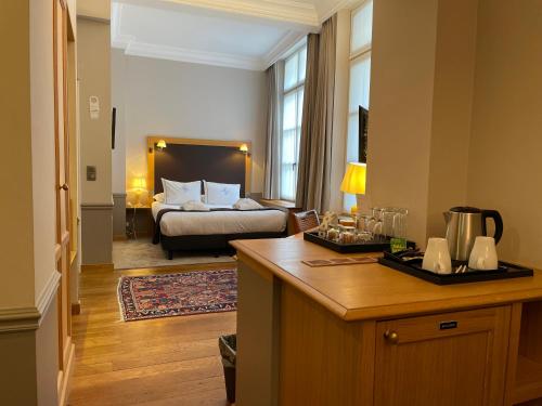 Postel nebo postele na pokoji v ubytování Hotel Le Dixseptième