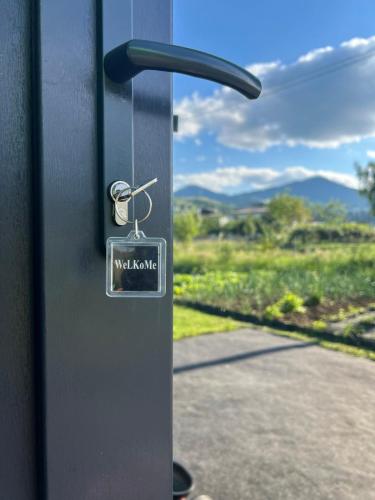 a close up of a door with a key on it at Шале WeLKoMe in Verkhovyna
