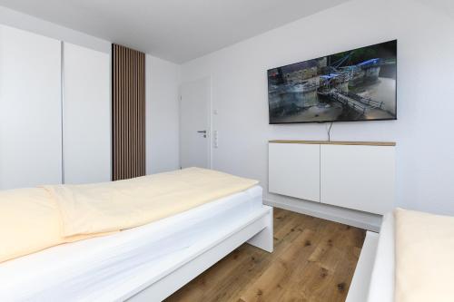 Ένα ή περισσότερα κρεβάτια σε δωμάτιο στο Ferienhaus Küstenfein