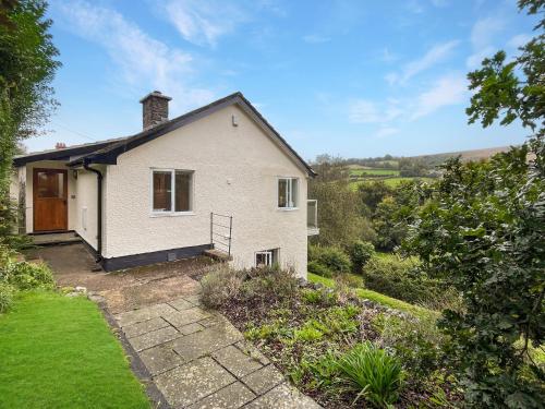 a house with a view of the garden at Ormrods in Withypool