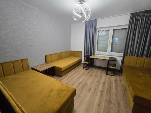 a hotel room with two beds and a window at MAESTRo TWO in Tychy
