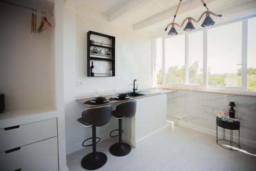 a bathroom with a counter and a sink and a tub at Suite La PerlaNera- TorreCanne in Torre Canne