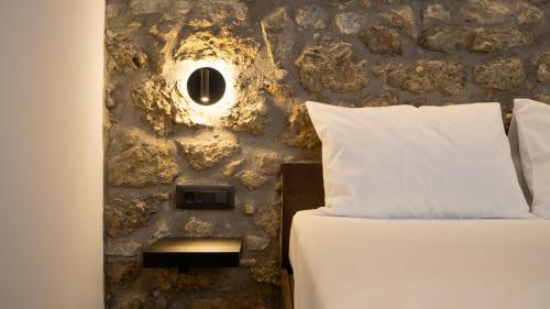 Ένα ή περισσότερα κρεβάτια σε δωμάτιο στο Stone Manor