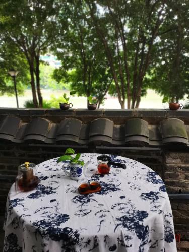 a table with a blue and white table cloth at XiXi Lakeside Inn in Guilin