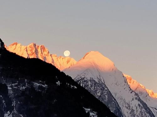 a view of a mountain with the moon in the sky at Artemisia Eco-Pet friendly B&B in La Salle