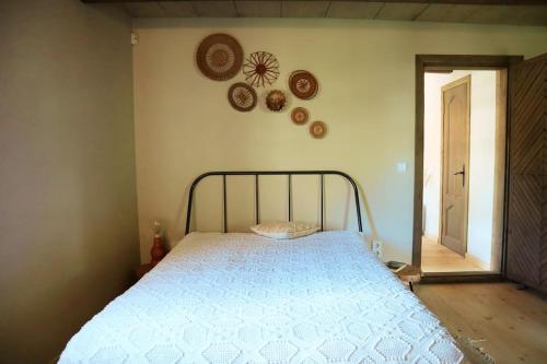 a bedroom with a bed in a room at An authentic granary in Bilioniai
