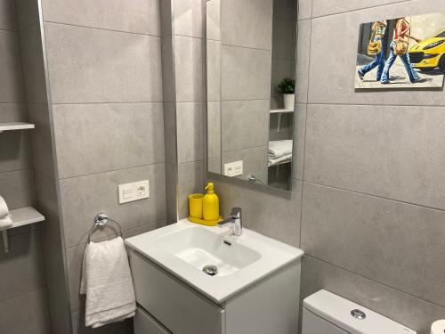 a bathroom with a sink and a mirror at Vivienda turística El Caminante con garaje in Soria