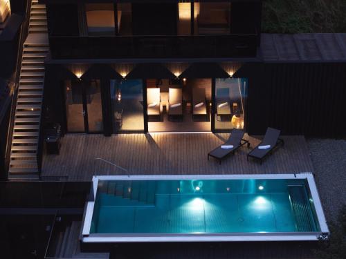 an overhead view of a house with a swimming pool at Paznauner Villen - Villa I in Kappl