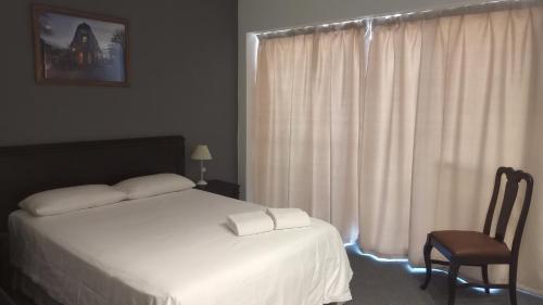 Ένα ή περισσότερα κρεβάτια σε δωμάτιο στο Hotel BA Congreso