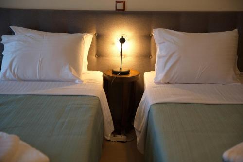 Postel nebo postele na pokoji v ubytování Seirios Guest House
