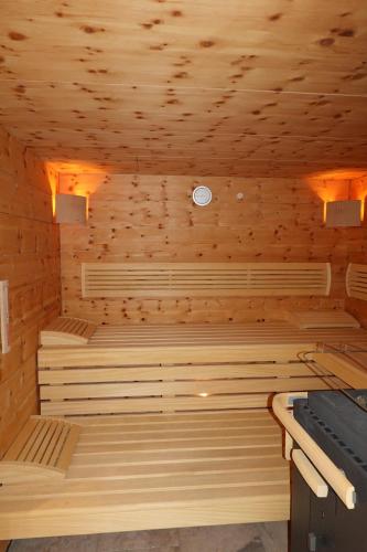 a sauna with wooden walls and wooden ceilings at Haus Christina in Serfaus