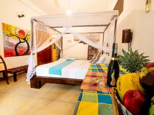Кровать или кровати в номере Frangipani Beach Villa