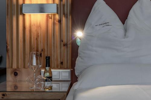 Una cama o camas en una habitación de Alpen Adria Hotel & Spa