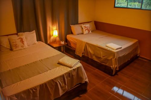 Postel nebo postele na pokoji v ubytování Coral Beach