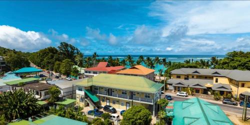 an aerial view of a town with the ocean at Royale Self Catering Apartments in Anse Royale