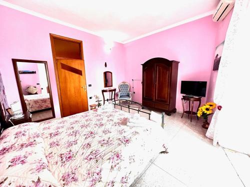 Ένα ή περισσότερα κρεβάτια σε δωμάτιο στο B&B La Tana dell'Orso