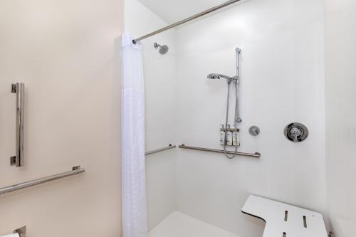 a bathroom with a shower and a sink at Candlewood Suites Erlanger - South Cincinnati by IHG in Erlanger
