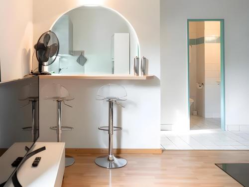a bathroom with a sink and a mirror at Modern apartments in the heart of Lausanne in Lausanne