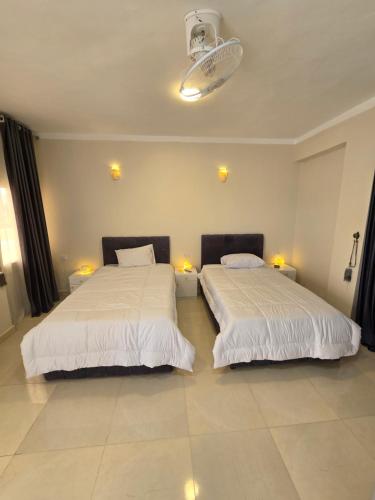Una cama o camas en una habitación de siriuspalaceluxor