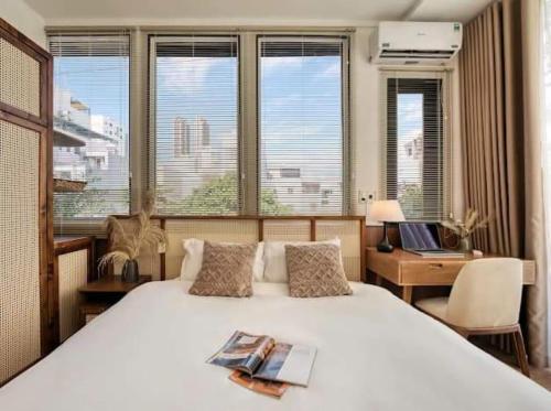 Postel nebo postele na pokoji v ubytování Villa GR Gần Trung Tâm Đà Nẵng