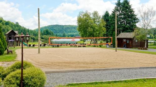 a playground with a volley ball goal in a park at Royal Laurentien in Mont-Blanc