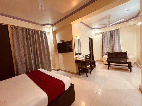 Una cama o camas en una habitación de Hotel Chariot Inn Patna