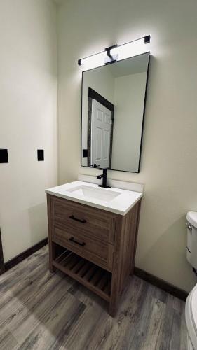 a bathroom with a sink and a mirror at Big Bear near Canyon Lakes in Kennewick