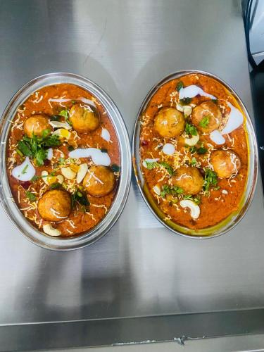 two bowls of food sitting on a table at Yashvrinda in Mandor